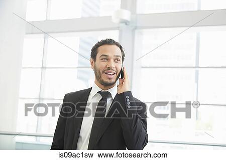 Businessman making phonecall View Large Photo Image Stock Photo - Businessman making phonecall. Fotosearch