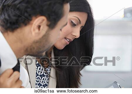Businesspeople using digital tablet View Large Photo Image Stock Image - Businesspeople using digital tablet. Fotosearch