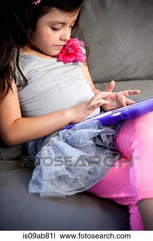 Child using digital tablet View Large Photo Image Stock Image - Child using digital tablet. Fotosearch