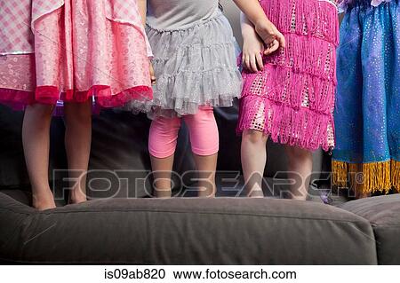 Children standing on sofa View Large Photo Image Stock Image - Children standing on sofa. Fotosearch