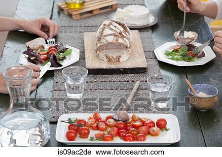 Close up of couple having lunch at table View Large Photo Image Stock Image - Close up of couple having lunch at table. Fotosearch