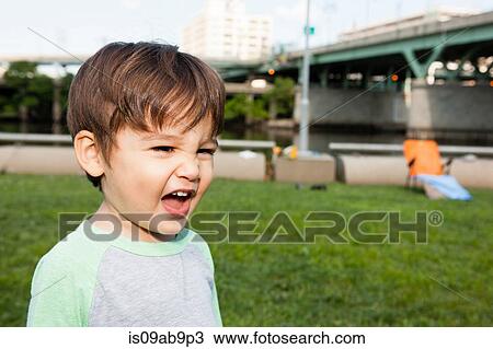 Stock Image - Close up of male toddler making a face. Fotosearch