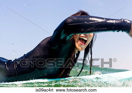 Stock Photograph - Close up of woman surfer, Hermosa Beach, California, USA. Fotosearch