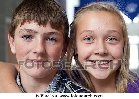 Stock Image - Close up portrait of boy and girl. Fotosearch