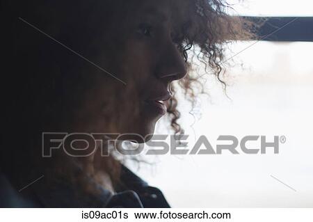 Stock Photograph - Close up portrait of sultry young woman. Fotosearch