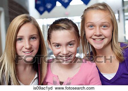 Close up portrait of three teen and pre-adolescent girls smiling View Large Photo Image Stock Image - Close up portrait of three teen and pre-adolescent girls smiling. Fotosearch