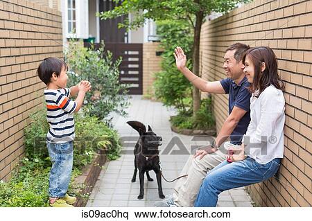 Family with dog, father waving to son View Large Photo Image Stock Photography - Family with dog, father waving to son. Fotosearch