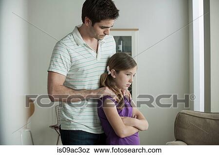 Father reassuring daughter View Large Photo Image Stock Photo - Father reassuring daughter. Fotosearch