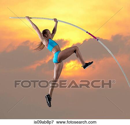 Female athlete doing pole vault View Large Photo Image Stock Photo - Female athlete doing pole vault. Fotosearch