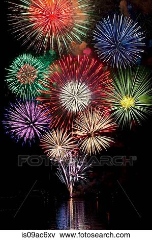 Fireworks exploding in night sky View Large Photo Image Stock Photo - Fireworks exploding in night sky. Fotosearch