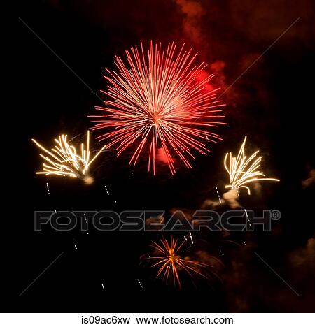 Fireworks exploding in night sky View Large Photo Image Stock Photo - Fireworks exploding in night sky. Fotosearch