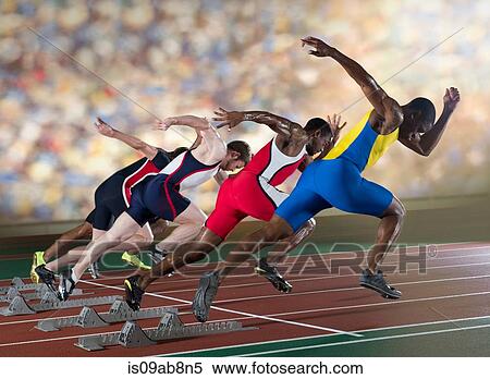 Stock Photography - Four athletes starting a sprint race. Fotosearch