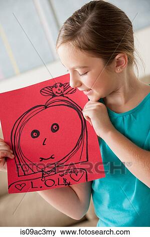 Girl with a drawing View Large Photo Image Stock Photo - Girl with a drawing. Fotosearch