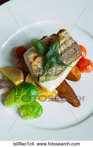 Picture - Grilled fish cutlet on plate. Fotosearch