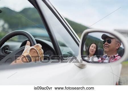 Image of couple in wing mirror View Large Photo Image Stock Photography - Image of couple in wing mirror. Fotosearch