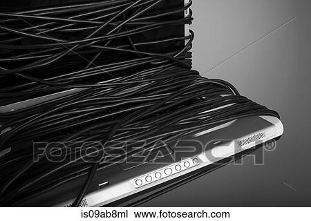 Laptop covered in power cable View Large Photo Image Stock Image - Laptop covered in power cable. Fotosearch