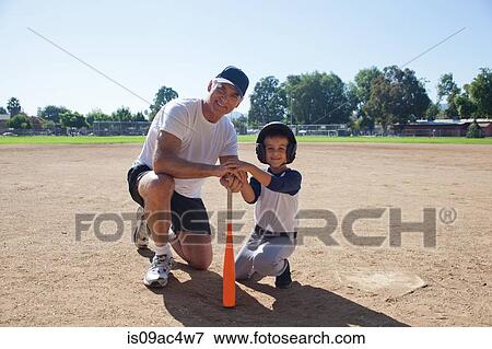Stock Photo - Man and grandson ready for baseball. Fotosearch