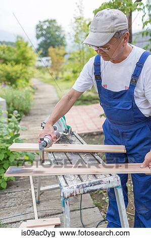 Man doing carpentry work View Large Photo Image Stock Image - Man doing carpentry work. Fotosearch