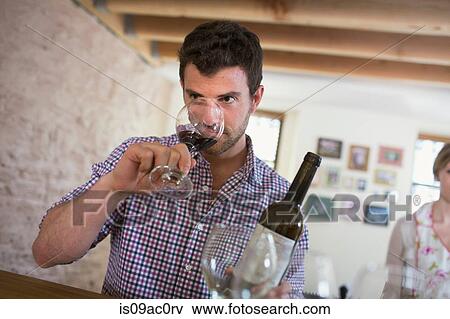 Stock Photo - Man drinking red wine. Fotosearch