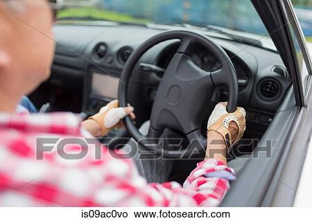 Man enjoying leisurely drive in sports car View Large Photo Image Picture - Man enjoying leisurely drive in sports car. Fotosearch