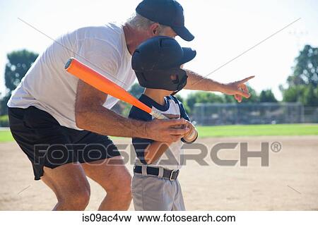 Man teaching grandson to play baseball View Large Photo Image Stock Photo - Man teaching grandson to play baseball. Fotosearch