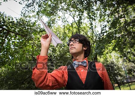 Man throwing paper plane View Large Photo Image Stock Photo - Man throwing paper plane. Fotosearch