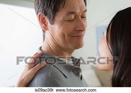 Mature couple, woman's hand on man's shoulder View Large Photo Image Stock Photograph - Mature couple, woman's hand on man's shoulder. Fotosearch