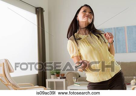 Mature dancing with mp3 player View Large Photo Image Stock Image - Mature dancing with mp3 player. Fotosearch