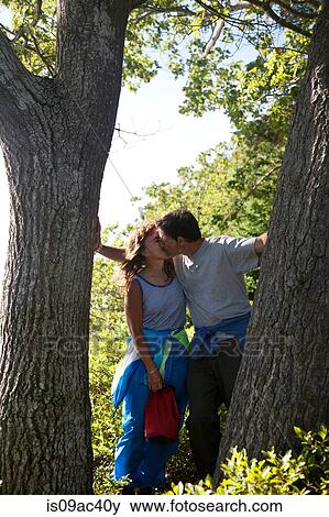 Stock Photo - Mature hiking couple kissing, Bath, Maine, USA. Fotosearch