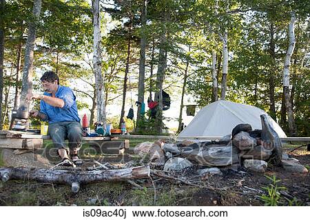 Mature man cooking on campsite, Bath, Maine, USA View Large Photo Image Stock Image - Mature man cooking on campsite, Bath, Maine, USA. Fotosearch