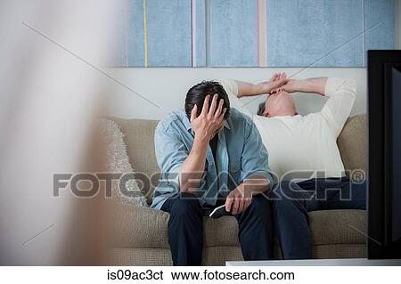 Mature men watching tv, head in hands View Large Photo Image Stock Photograph - Mature men watching tv, head in hands. Fotosearch