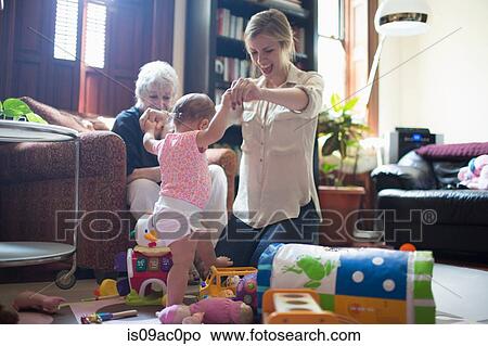 Picture - Mother helping daughter learn to walk. Fotosearch