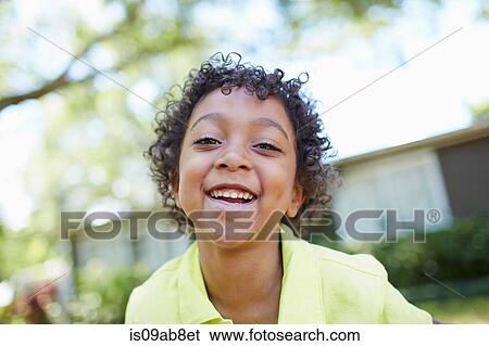 Stock Photograph - Portrait of boy smiling. Fotosearch