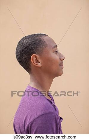 Portrait of boy wearing purple t-shire, side view View Large Photo Image Stock Photo - Portrait of boy wearing purple t-shire, side view. Fotosearch