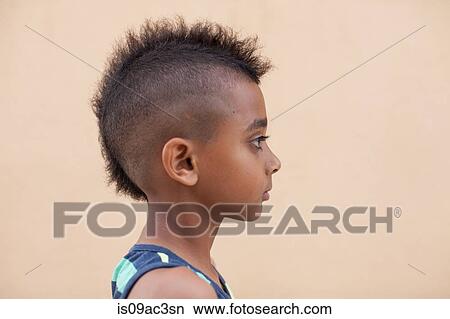 Portrait of boy with mohawk hairstyle, side view View Large Photo Image Picture - Portrait of boy with mohawk hairstyle, side view. Fotosearch