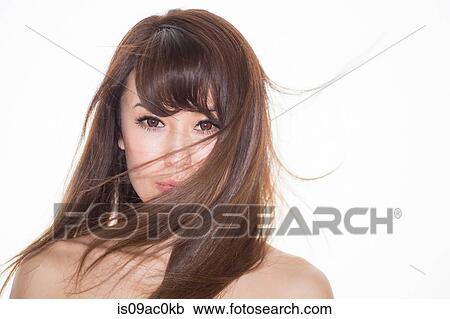 Portrait of brunette woman with windswept hair View Large Photo Image Stock Image - Portrait of brunette woman with windswept hair. Fotosearch