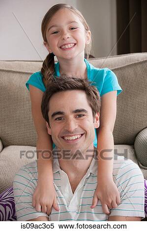 Portrait of father and daughter smiling at camera View Large Photo Image Stock Photography - Portrait of father and daughter smiling at camera. Fotosearch