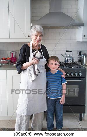 Portrait of grandmother and grandson in kitchen View Large Photo Image Stock Photo - Portrait of grandmother and grandson in kitchen. Fotosearch