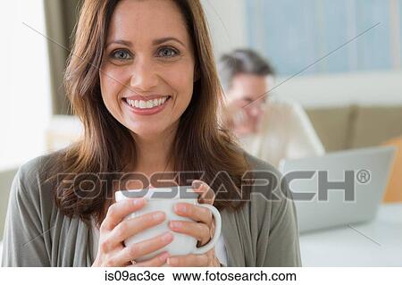 Portrait of mature woman holding coffee View Large Photo Image Stock Image - Portrait of mature woman holding coffee. Fotosearch