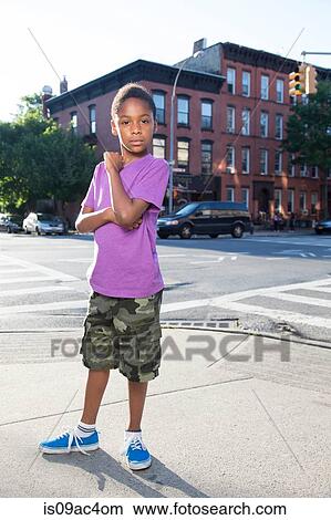 Portrait of teenage boy on sidewalk, Brooklyn, New York, USA View Large Photo Image Picture - Portrait of teenage boy on sidewalk, Brooklyn, New York, USA. Fotosearch