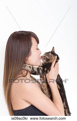 Portrait of woman kissing tabby cat View Large Photo Image Stock Photography - Portrait of woman kissing tabby cat. Fotosearch