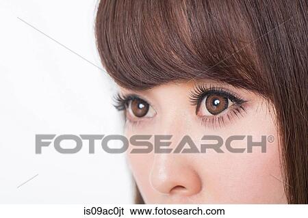 Portrait of woman with brown eyes, close up View Large Photo Image Stock Photograph - Portrait of woman with brown eyes, close up. Fotosearch