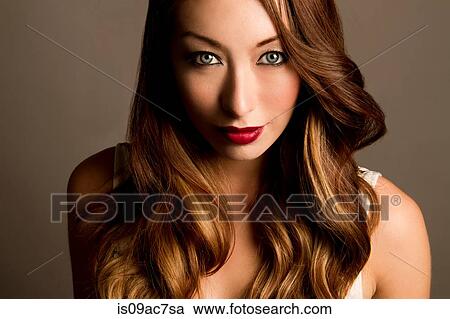 Studio portrait of brunette woman looking at camera View Large Photo Image Stock Image - Studio portrait of brunette woman looking at camera. Fotosearch