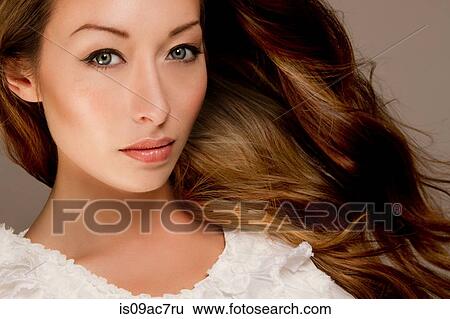 Studio portrait of brunette woman looking at camera View Large Photo Image Stock Photograph - Studio portrait of brunette woman looking at camera. Fotosearch