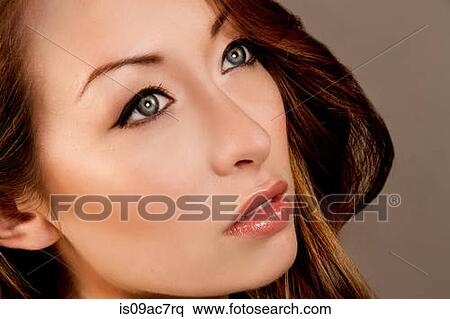 Studio portrait of brunette woman looking away View Large Photo Image Stock Photography - Studio portrait of brunette woman looking away. Fotosearch