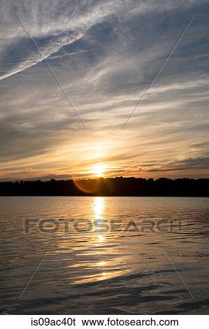 Stock Photograph - Sunset over lake, Bath, Maine, USA. Fotosearch