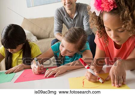 Three girls drawing pictures View Large Photo Image Stock Image - Three girls drawing pictures. Fotosearch
