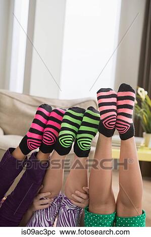 Three girls wearing brightly coloured socks View Large Photo Image Stock Image - Three girls wearing brightly coloured socks. Fotosearch