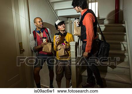 Three young friends in stairwell View Large Photo Image Stock Image - Three young friends in stairwell. Fotosearch