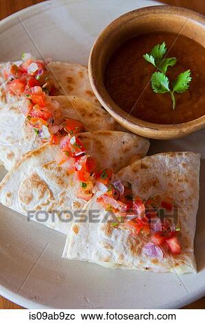 Stock Image - Tortillas with tomato salsa. Fotosearch